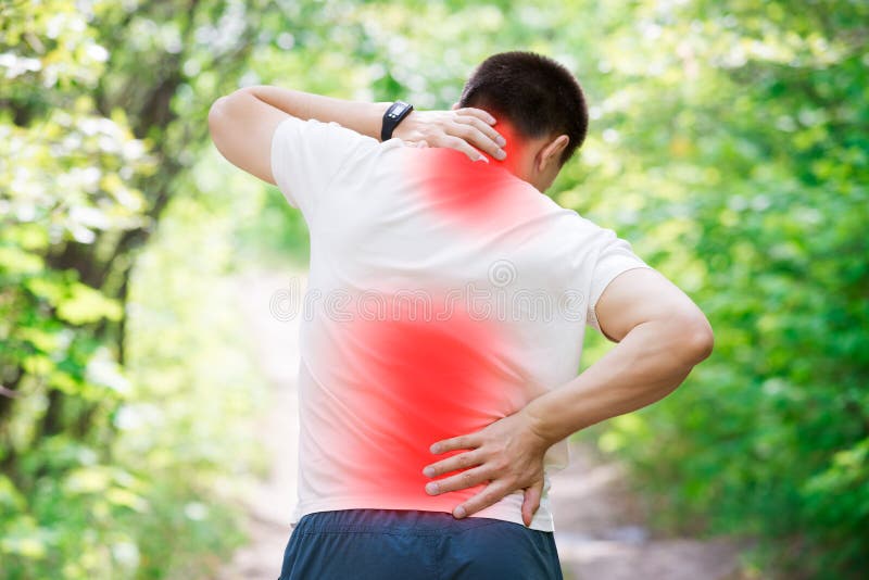 Man with back pain, injury while running, trauma during workout, outdoors concept. Man with back pain, injury while running, trauma during workout, outdoors concept