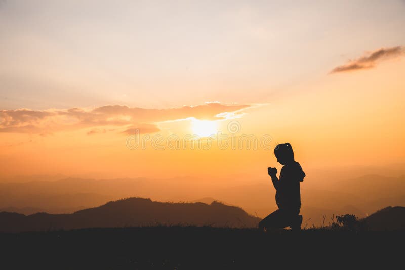 Religious young woman praying to God in the morning, spirtuality and religion, Religious concepts. Religious young woman praying to God in the morning, spirtuality and religion, Religious concepts.