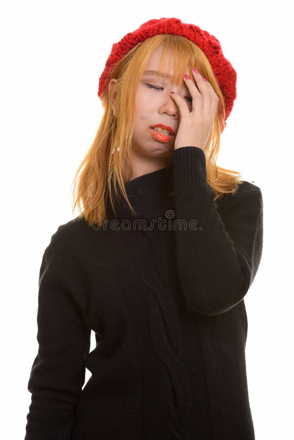 Młoda śliczna Azjatycka kobieta ma migrenę i frustrację fotografia stock Młoda śliczna Azjatycka kobieta ma migrenę i frustrację fotografia stock