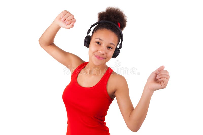 Young african american girl listening music isolated. Young african american girl listening music isolated