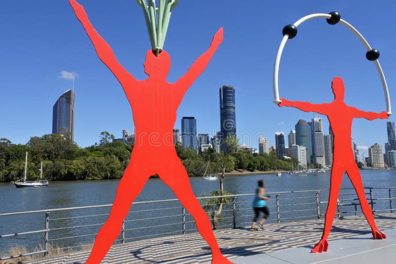 Młody Australijski kobieta bieg wzdłuż Brisbane rzeczny Queensland Australia fotografia stock Młody Australijski kobieta bieg wzdłuż Brisbane rzeczny Queensland Australia fotografia stock