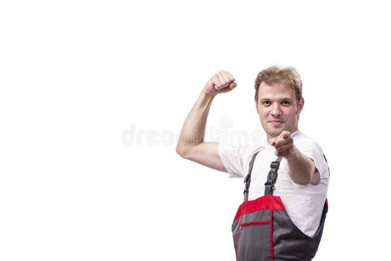 Młody pracownik budowlany jest ubranym coveralls odizolowywających na bielu fotografia royalty free Młody pracownik budowlany jest ubranym coveralls odizolowywających na bielu fotografia royalty free