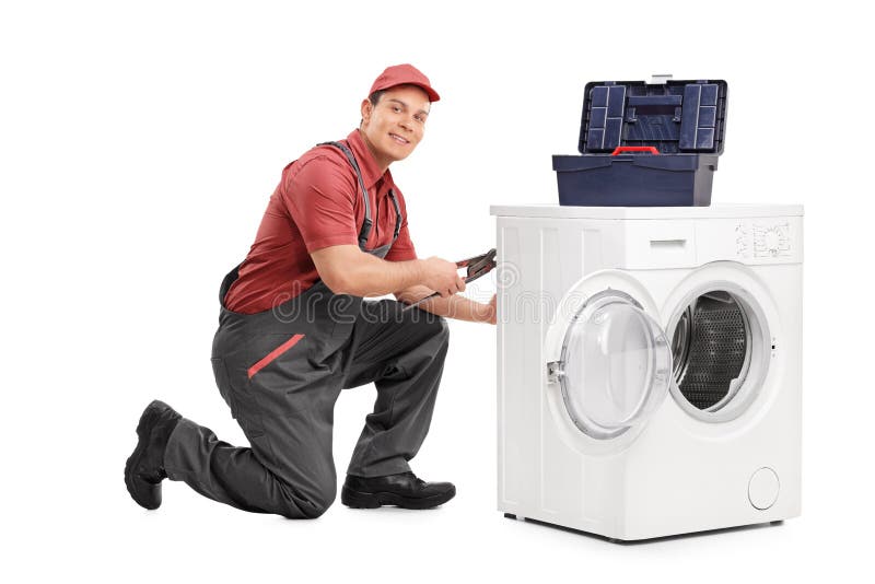 Młody repairman załatwia pralkę obraz stock
