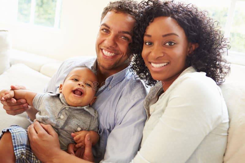 Young Family Playing With Happy Baby Son At Home. Young Family Playing With Happy Baby Son At Home