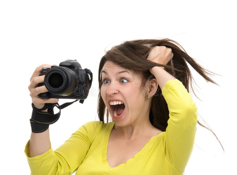 Młody żeński fotograf bierze fotografie patrzeje nowego cyfrowego c obrazy royalty free Młody żeński fotograf bierze fotografie patrzeje nowego cyfrowego c obrazy royalty free