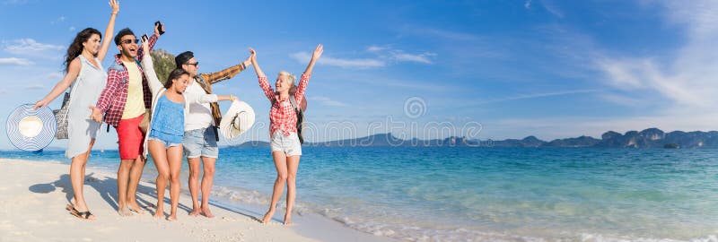 Young People Group On Beach Summer Vacation, Happy Smiling Friends Walking Seaside Sea Ocean Holiday Travel. Young People Group On Beach Summer Vacation, Happy Smiling Friends Walking Seaside Sea Ocean Holiday Travel