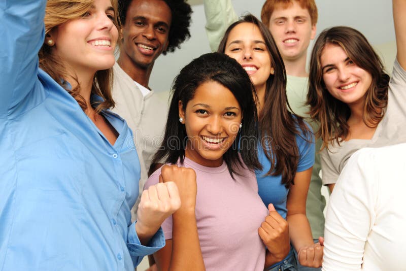 Excited and happy group of diverse young people cheering. Excited and happy group of diverse young people cheering