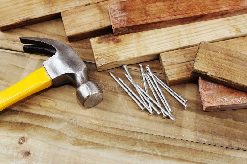 Hammer and nails on wood. Hammer and nails on wood