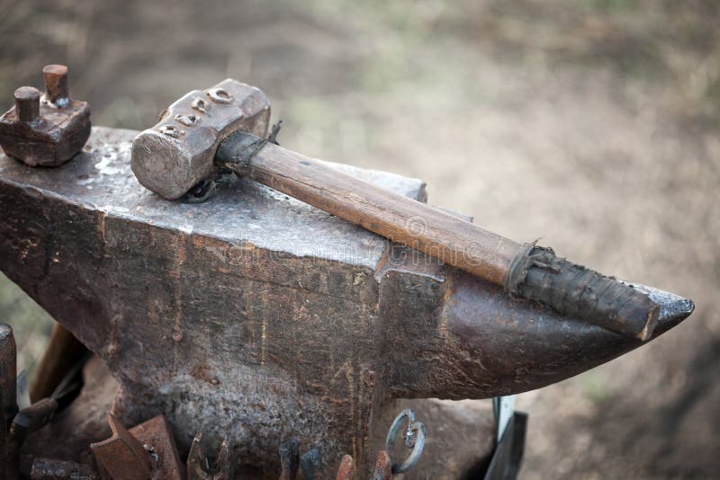 Hammer is on thr blacksmith anvil. Hammer is on thr blacksmith anvil