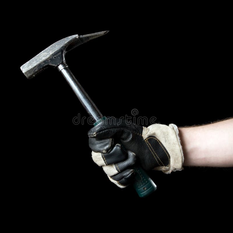Hammer in hand. Isolated on a black background. Hammer in hand. Isolated on a black background.