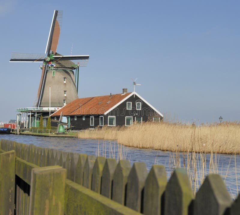 One of the famous windmills in The Zaanseschans area, near Amsterdam. The netherlands. One of the famous windmills in The Zaanseschans area, near Amsterdam. The netherlands.