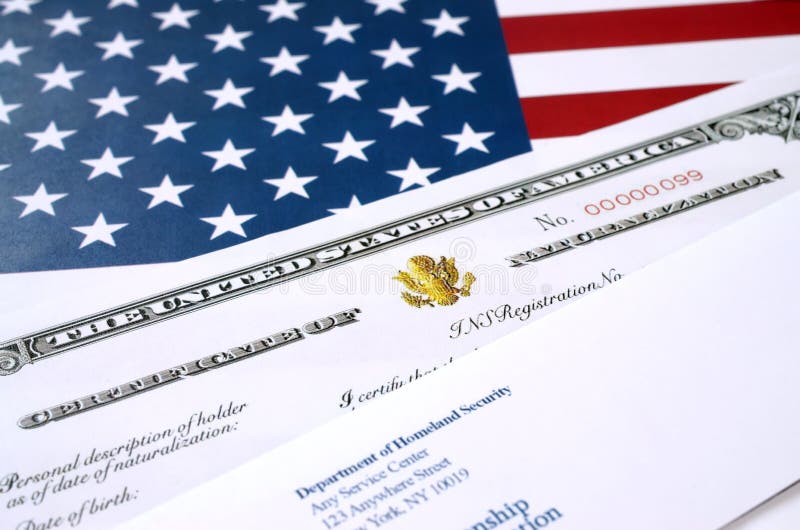 N-550 United States Naturalization Certificate of citizenship and envelope from Department of homeland security on USA flag stock photo