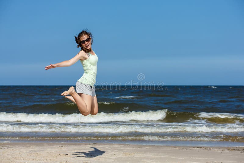 Girl jumping, playing on beach. Girl jumping, playing on beach