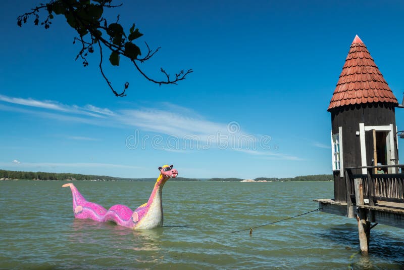 Naantali, Finland - 28 June, 2019: Bathing hut and Edvard the Booble in park Moominworld at sunny summer day royalty free stock photo Naantali, Finland - 28 June, 2019: Bathing hut and Edvard the Booble in park Moominworld at sunny summer day royalty free stock photo