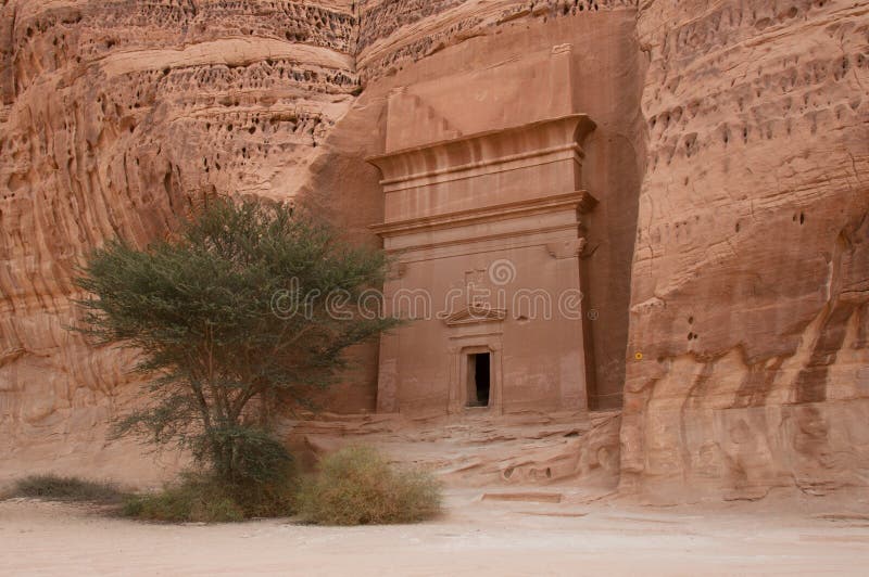 Nabatean tomb in MadaÃ®n Saleh archeological site, Saudi Arabia royalty free stock photography