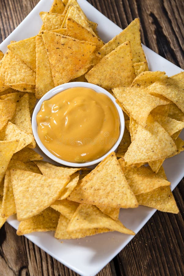 Nachos with Cheese Dip stock photo. Image of sauce, crunchy - 59449052