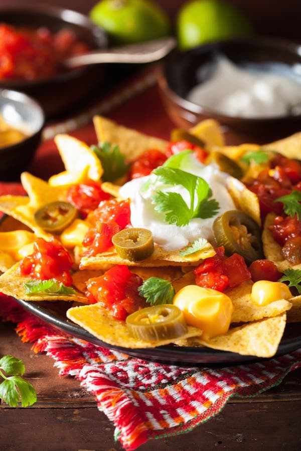 Nachos Loaded With Salsa, Guacamole, Cheese And Jalapeno Stock Photo Image of pepper