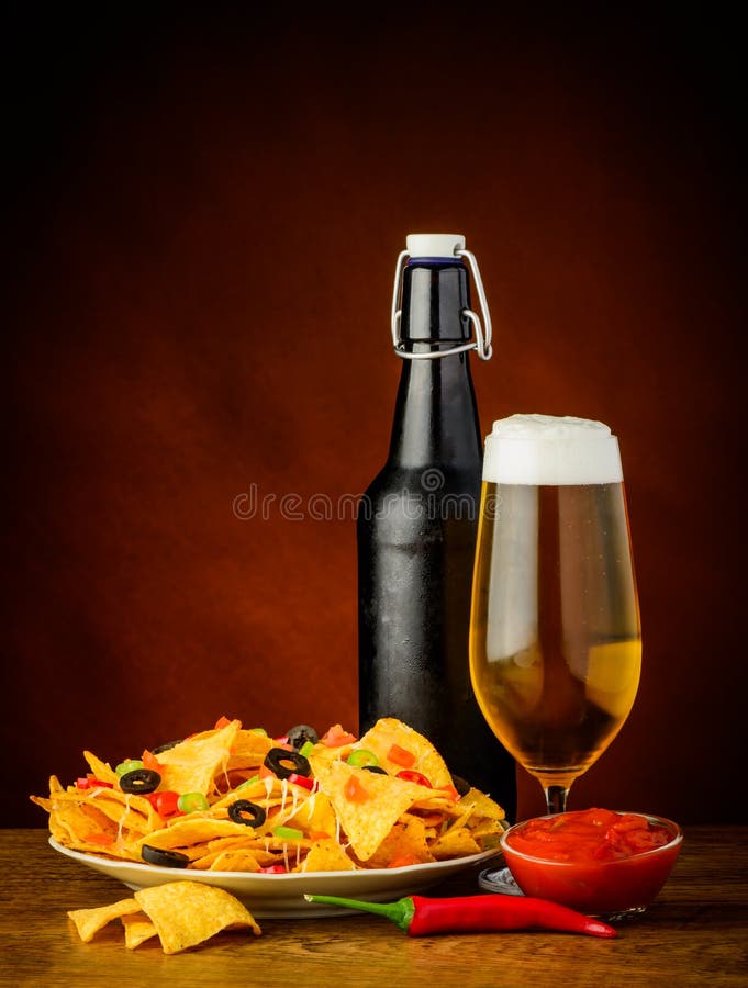 Nachos, salsa dip and beer stock photos