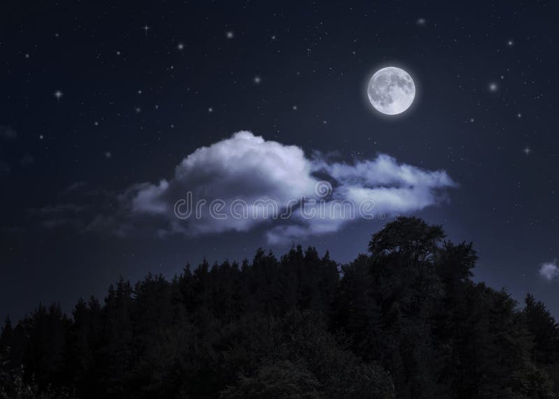 Night starry sky and moon over the mountain. Night cloudy sky. Halloween an christmas background. Night starry sky and moon over the mountain. Night cloudy sky. Halloween an christmas background