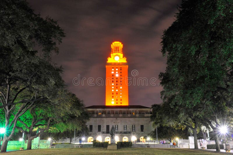 University of Texas Tower, or UT Tower, and fountain illuminated at night. University of Texas Tower, or UT Tower, and fountain illuminated at night.