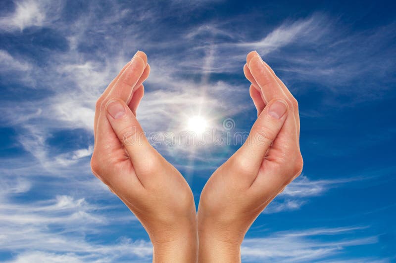 Female hands over blue sky with clouds - religion and environment protection concept. Female hands over blue sky with clouds - religion and environment protection concept