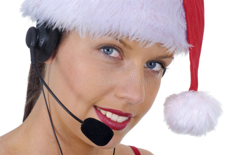 Nahaufnahme attraktiver weiblicher Call-Center-Telefonist tragenden Weihnachts-Sankt-Hutes lizenzfreies stockfoto Nahaufnahme attraktiver weiblicher Call-Center-Telefonist tragenden Weihnachts-Sankt-Hutes lizenzfreies stockfoto