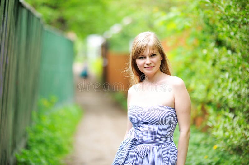 Close-up portrait of beautiful young blond woman posing outdoors. Close-up portrait of beautiful young blond woman posing outdoors