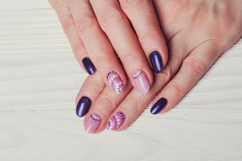Nail art with purple and pink colors stock image