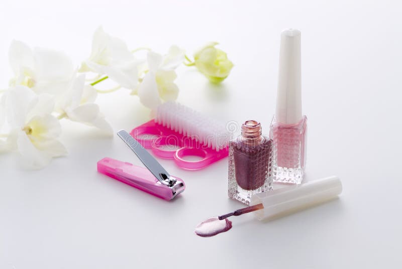 Nail Care Spa Set with Rose Polish, Cream White Background Top View