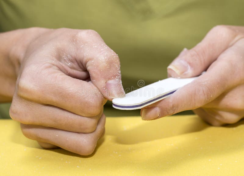 Nail Care with a Nail File. Stock Photo Image of cosmetics, file