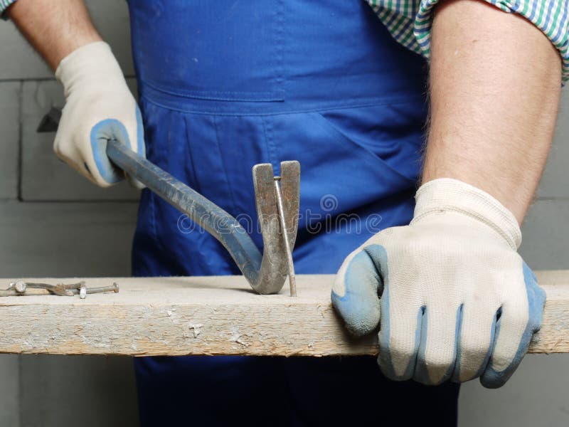 Crow bar pulling a nail stock photo. Image of white, remove 13538312