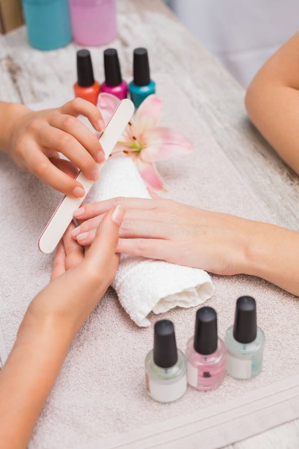 Nail Technician Giving Customer a Manicure Stock Photo Image of