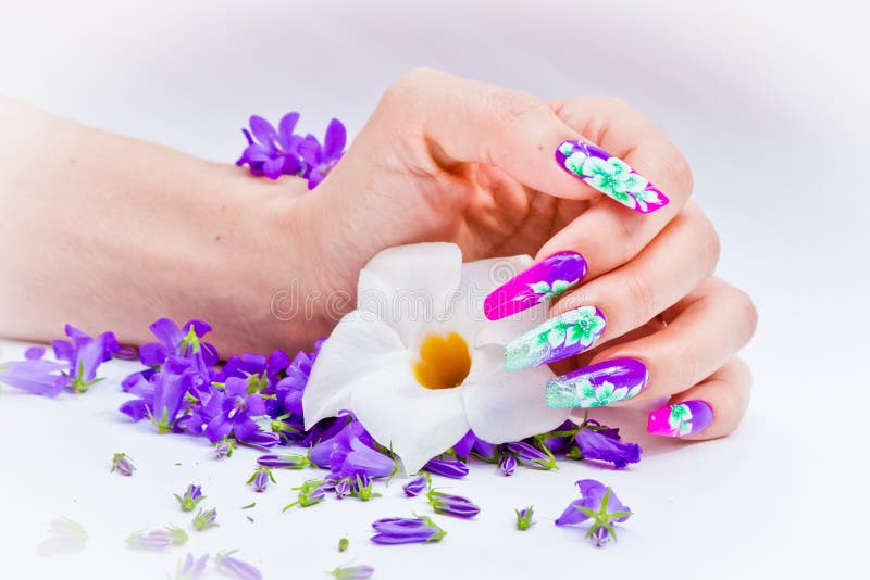 Nails decorated with floral arrangements for a colorful spring a royalty free stock images Nails decorated with floral arrangements for a colorful spring a royalty free stock images