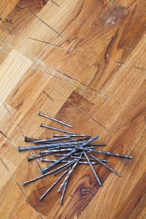 Nails on wood table stock photo. Image of hardware, nails 48616576