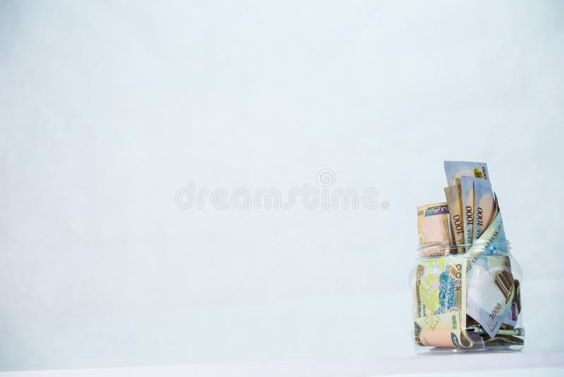 Naira nigeriano em uma garrafa - conceito de economias locais imagens de stock royalty free Naira nigeriano em uma garrafa - conceito de economias locais imagens de stock royalty free