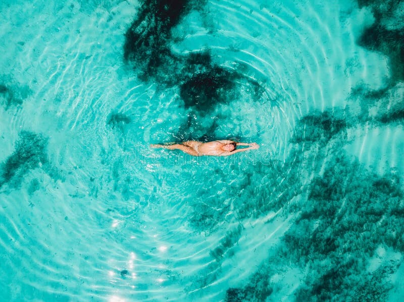 Naked Woman Swimming In Water