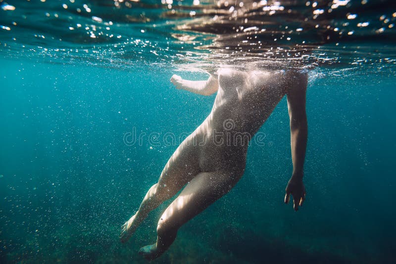 Naked Woman Swimming In Water