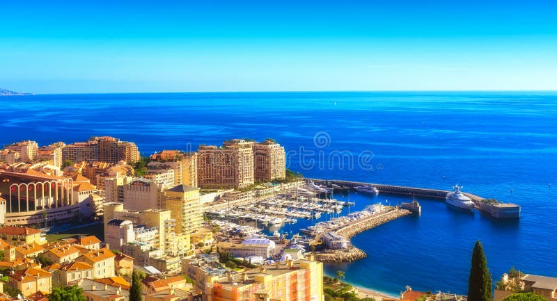 A lower altitude view of the port in Cap d`Ail and parts of the residential district of Fontvieille in Monaco. A lower altitude view of the port in Cap d`Ail and parts of the residential district of Fontvieille in Monaco.