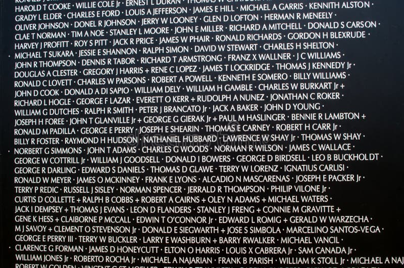 A close up of some of the names of over 58,000 veterans remembered at the vietnam memorial wall. A close up of some of the names of over 58,000 veterans remembered at the vietnam memorial wall