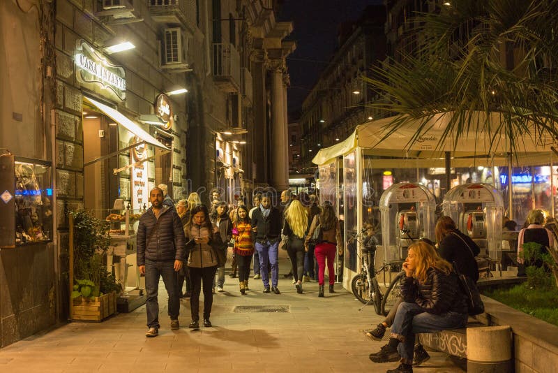 NAPLES, ITALY - OCTOBER 31, 2015: Unknown walking people on the one of the central streets in the historical part of Naples at stock image NAPLES, ITALY - OCTOBER 31, 2015: Unknown walking people on the one of the central streets in the historical part of Naples at stock image