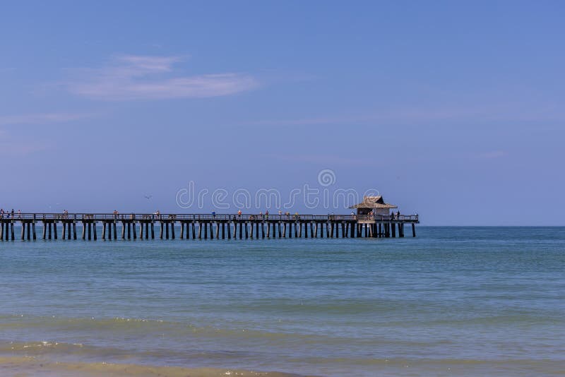 Naples Pier Blue Sky Blu Sea Stock Photo Image of wave, breakwater