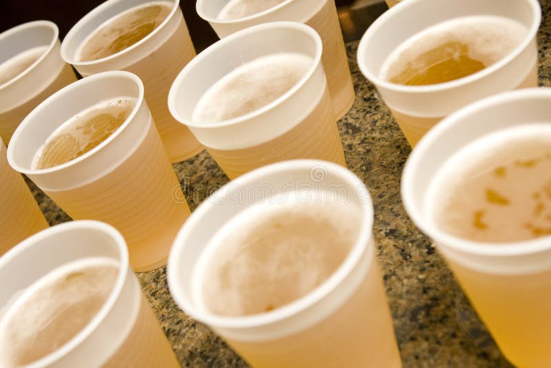 Several drinks sitting on a table ready to be drank. Several drinks sitting on a table ready to be drank