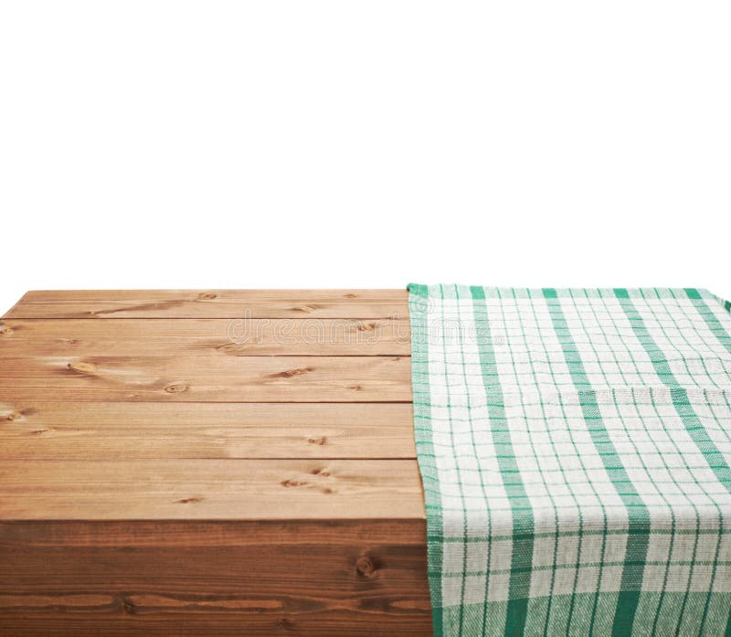 Green tablecloth or towel over the surface of a brown wooden table, composition isolated over the white background. Green tablecloth or towel over the surface of a brown wooden table, composition isolated over the white background