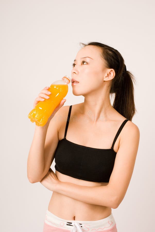 Girl drink after yoga exericise on white background. Girl drink after yoga exericise on white background