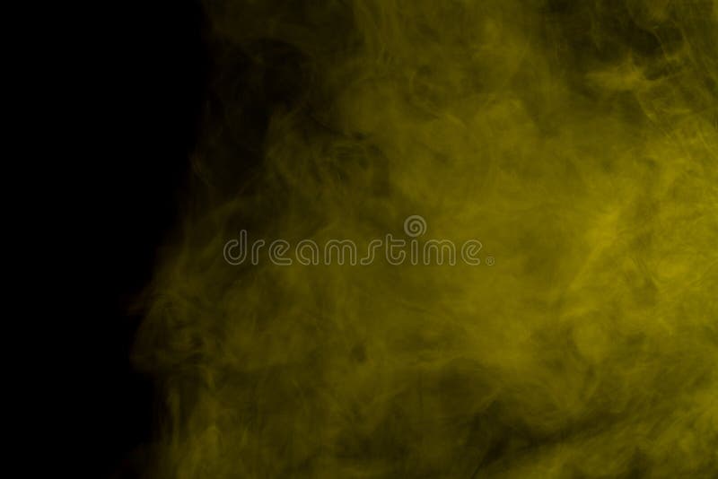 Abstract art. Yellow smoke hookah on a black background. Inhalation. The steam generator. The concept of poison gas. Abstract art. Yellow smoke hookah on a black background. Inhalation. The steam generator. The concept of poison gas.