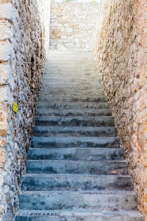 Narrow Concrete Steps Between Stone Walls