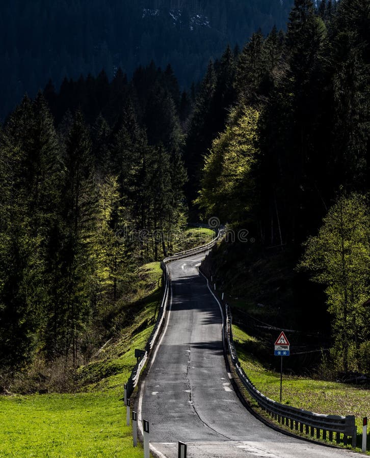 Curvy Road Around the Cliff with Mountains in the Background Stock Image -  Image of forest, garda: 153827873