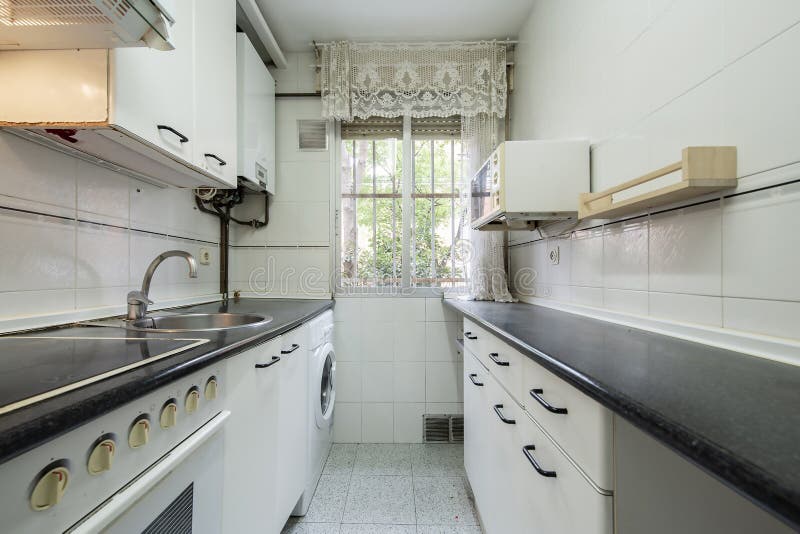Narrow Kitchen with on Both Sides of the Wall with White