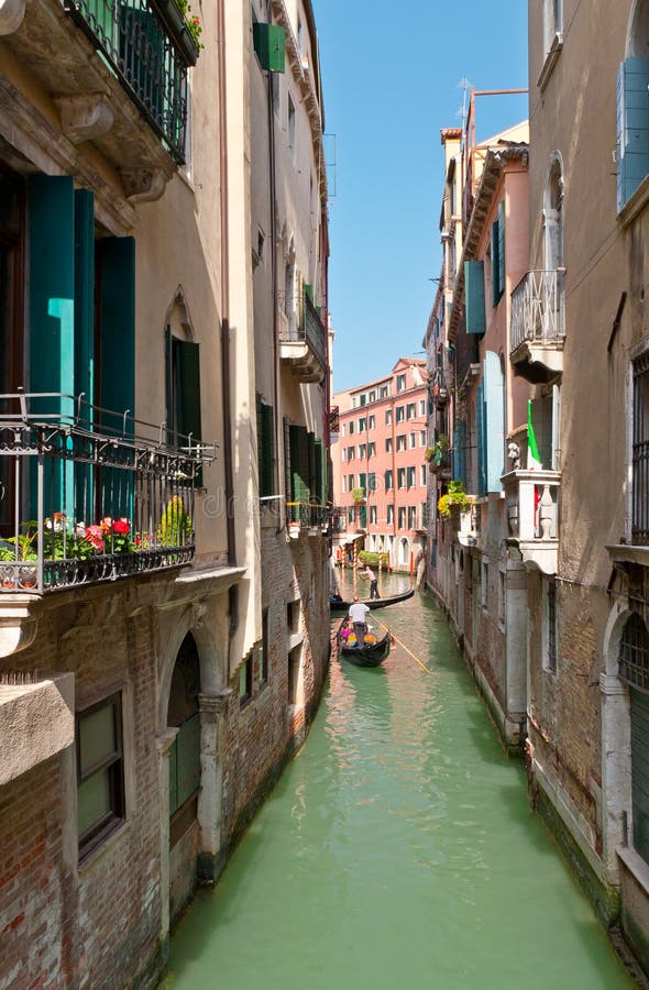the narrow street - channel in venice, italy stock photo