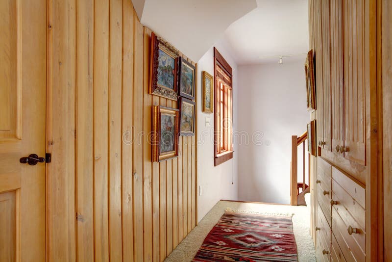 Narrow wood plank paneled hallway royalty free stock image